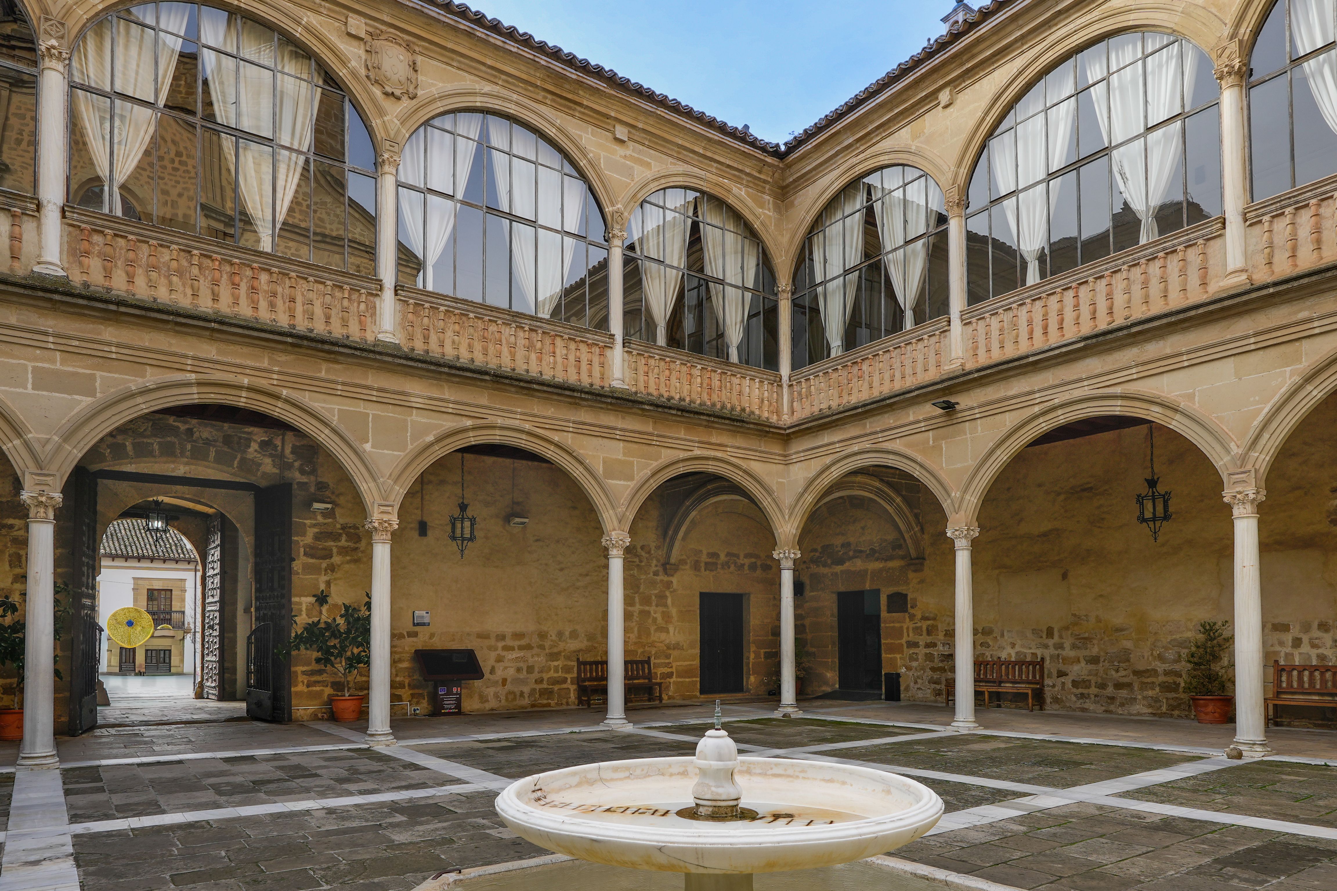 Quiet interior courtyard of an old Segovia townhouse hotel at dusk