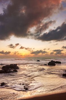 Breathtaking sunrise at Natal Beach, Brazil with vibrant skies and gentle waves.