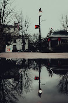Rain-soaked street with reflections in Canton, Georgia's downtown.