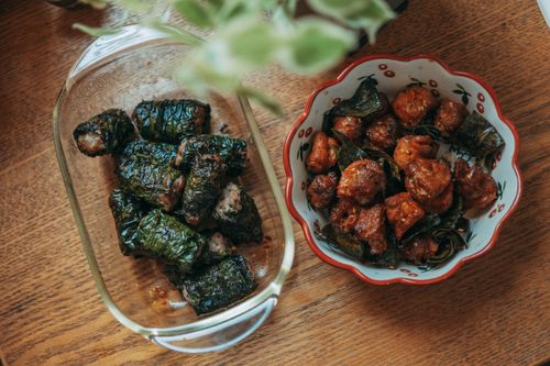 Free Vibrant Vietnamese dishes beautifully presented on a wooden table, showcasing traditional flavors. Stock Photo
