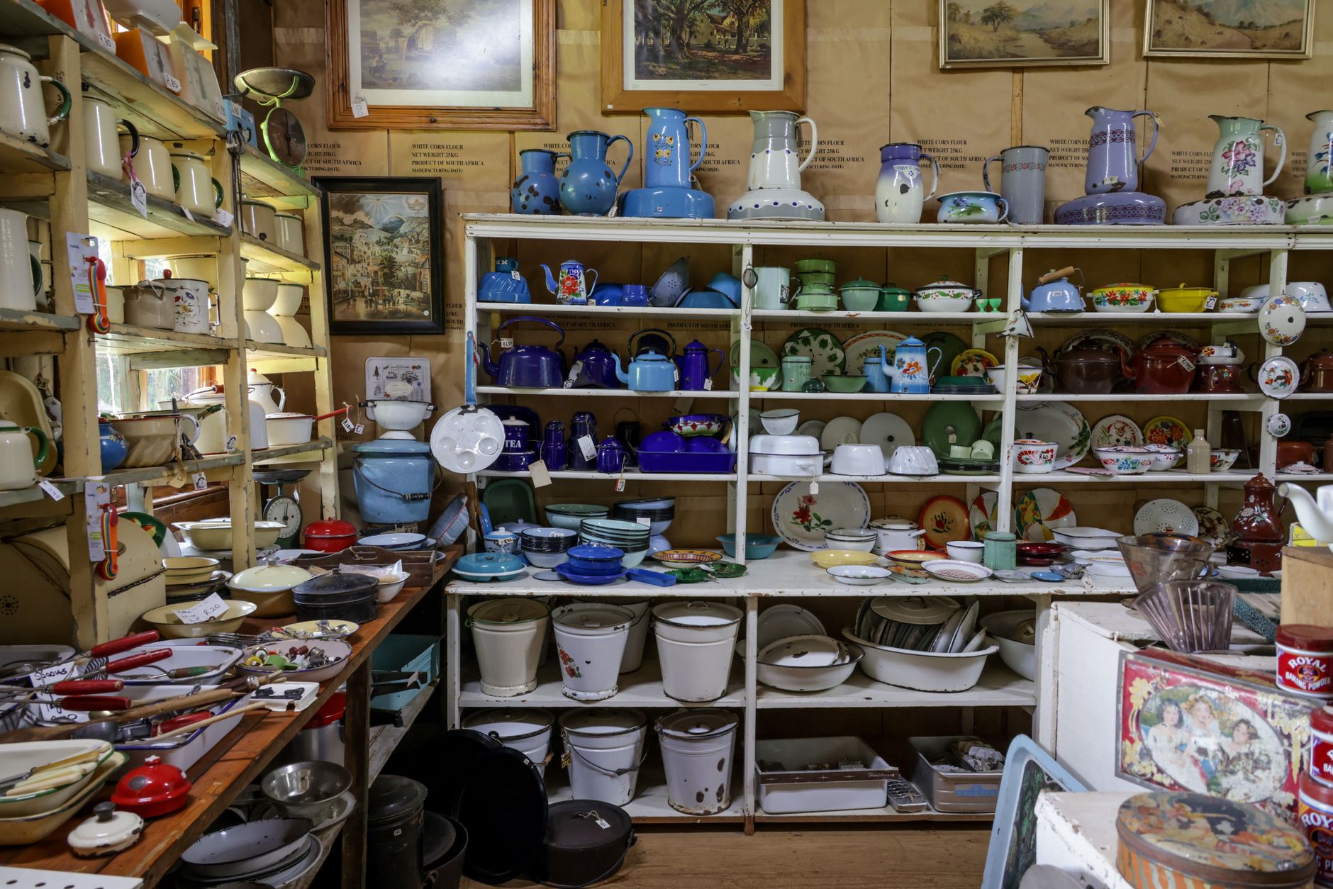 Explore a charming collection of vintage kitchenware in a cozy antique shop.