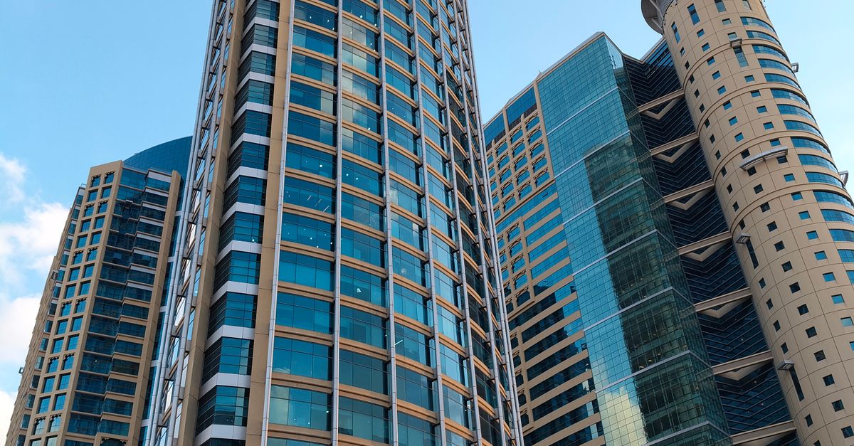 Modern High-Rise Towers Against Blue Sky · Free Stock Photo
