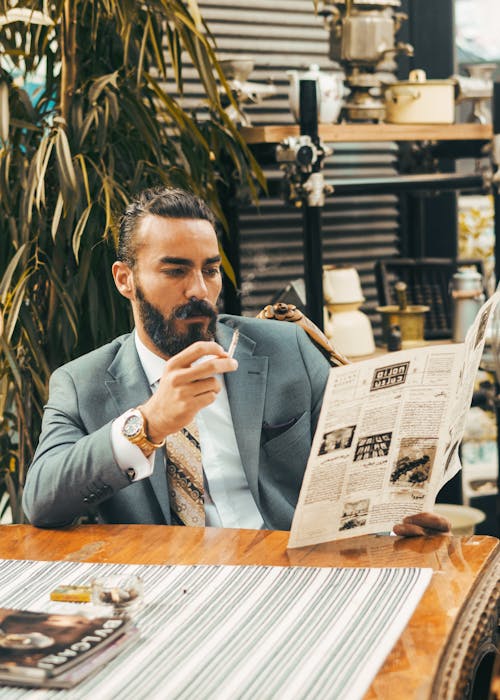 Man in Gray Suit Reading the Menu