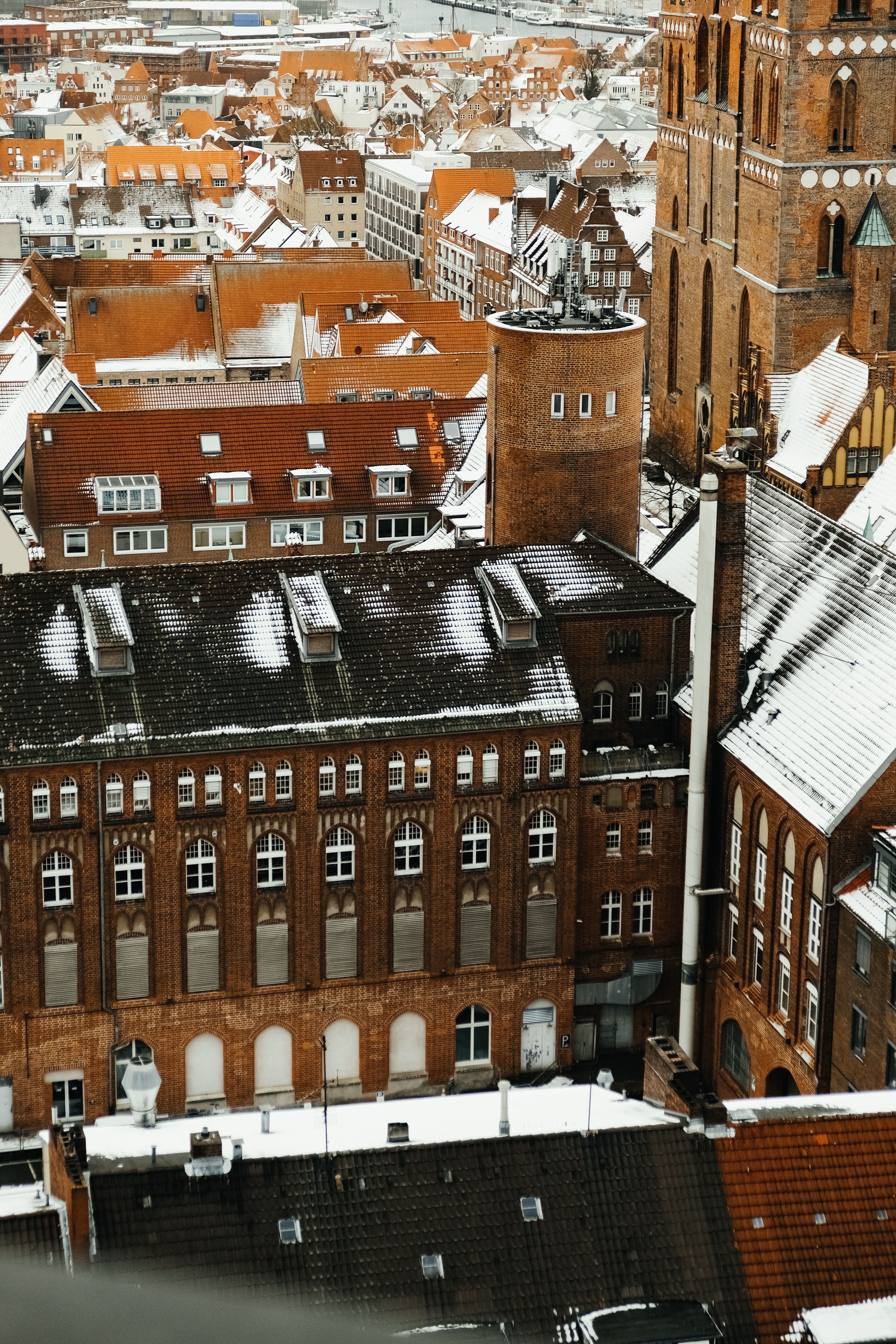 Aerial View of Snow-Covered European Cityscape · Free Stock Photo