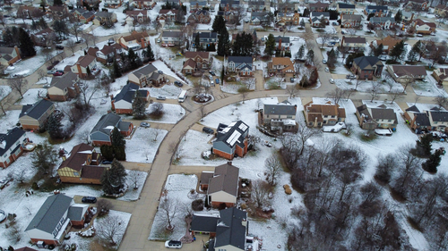 Free Aerial photograph of a snow-dusted suburban neighborhood in Novi, Michigan, during winter. Stock Photo