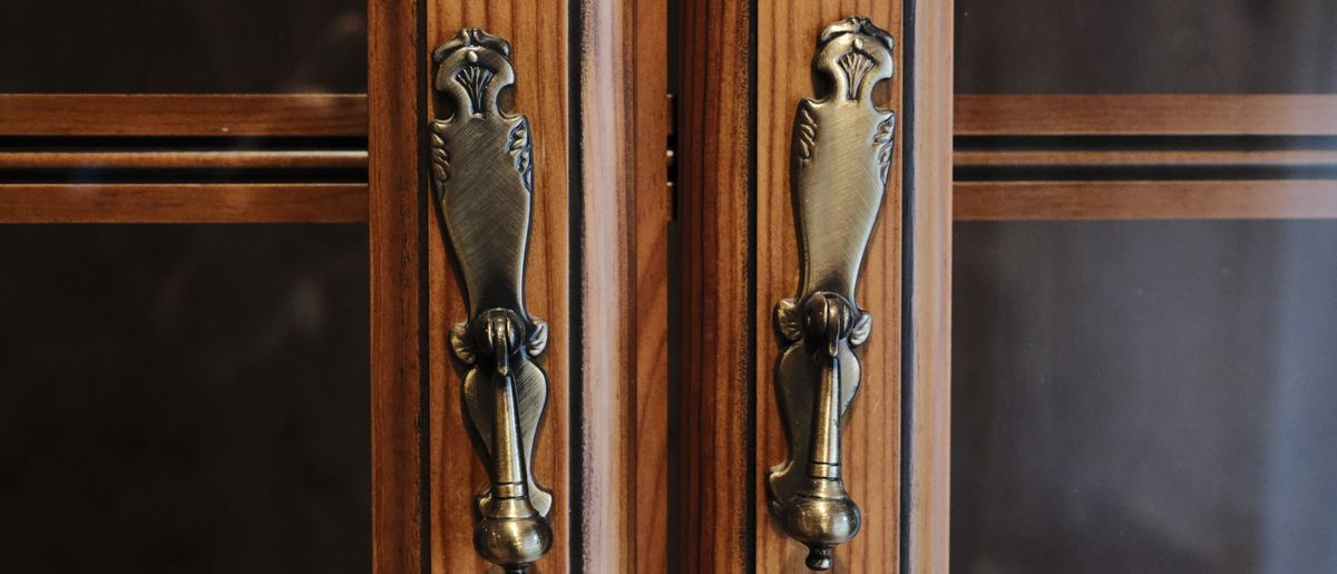 New pulls being installed on kitchen cabinets in a Rockville home