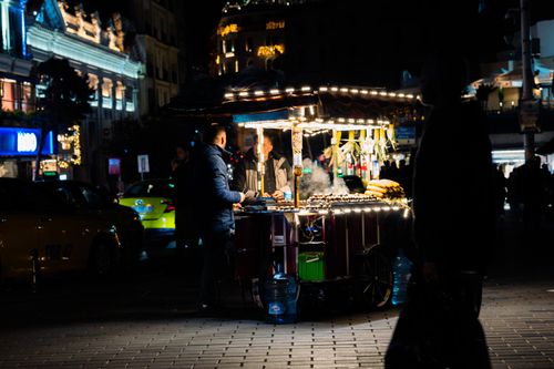 Free A bustling street food vendor in Taksim Square, Istanbul, illuminated at night. Stock Photo