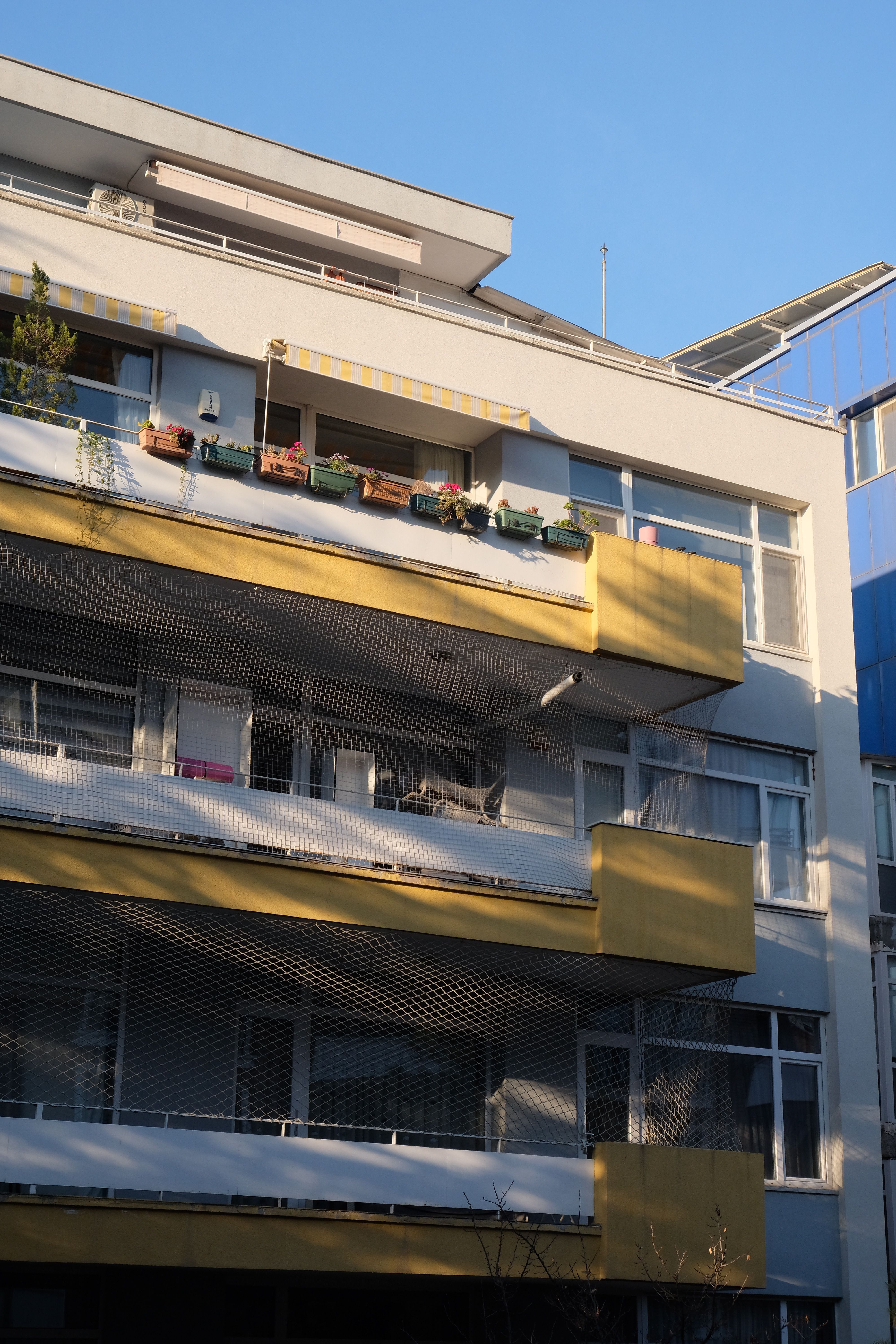 Modern Residential Apartment Building with Balconies · Free Stock Photo