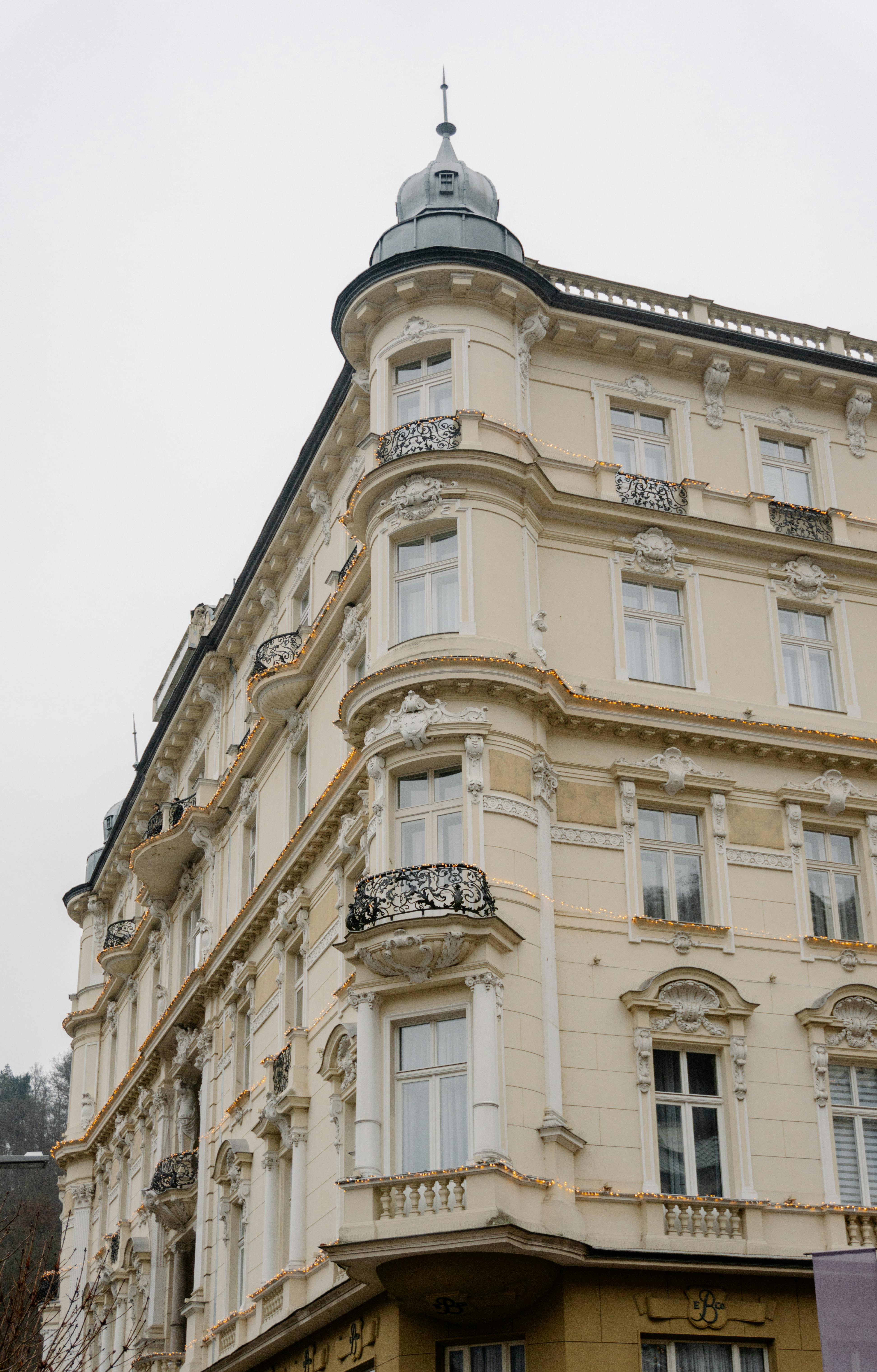 Discover this elegant European neoclassical building with ornate details and a vintage appeal.