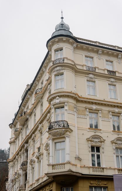 Discover this elegant European neoclassical building with ornate details and a vintage appeal.