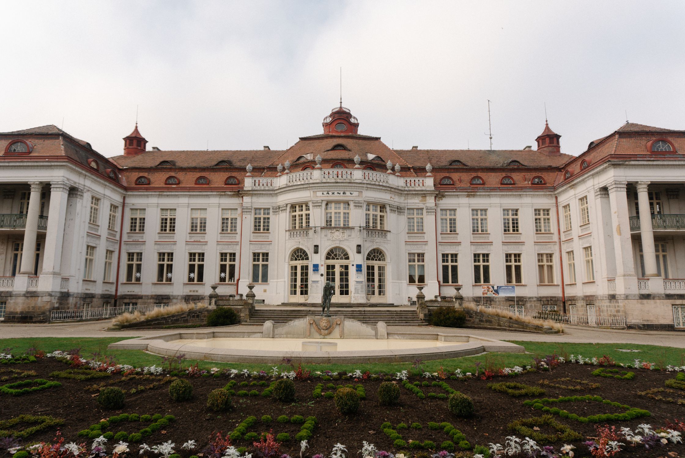 Historic European Building with Statues and Gardens · Free Stock Photo