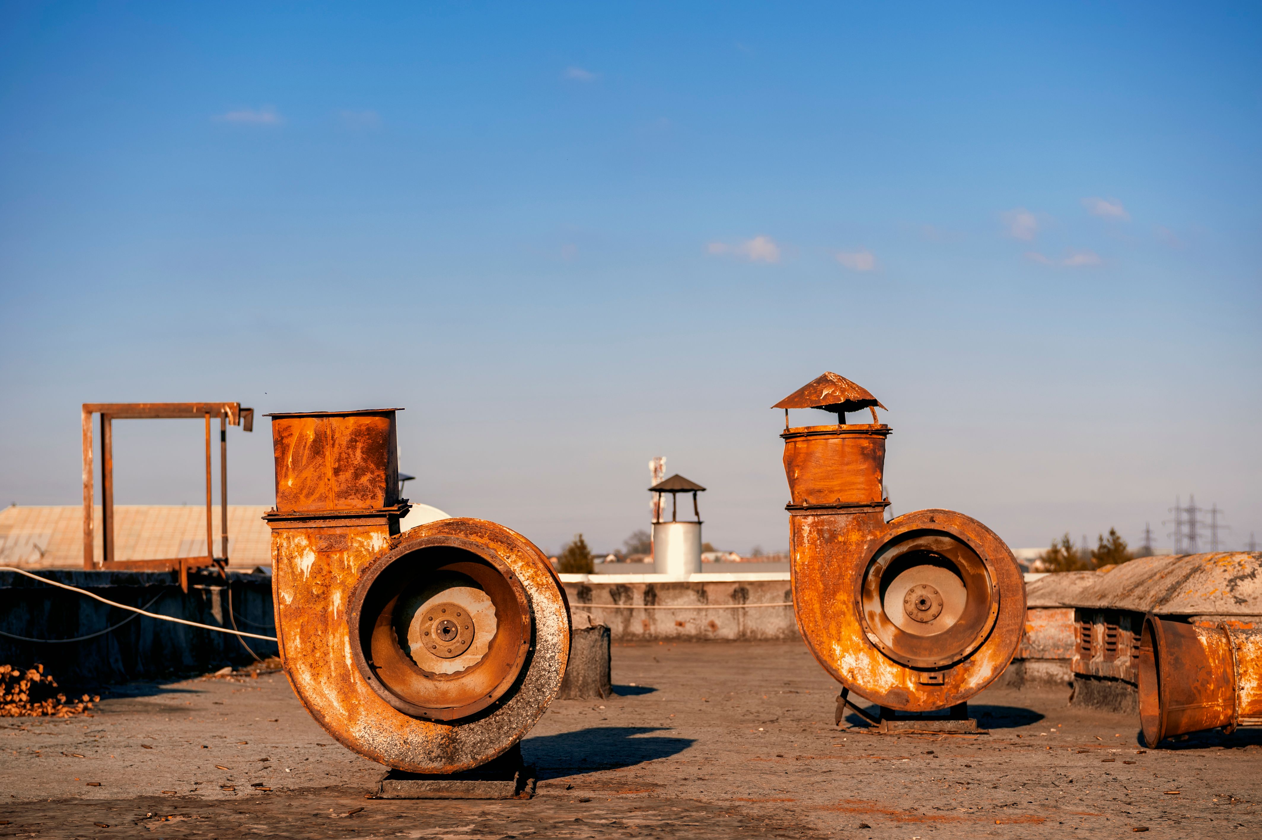 Rusty Industrial Vent Pipes on Rooftop in Lviv · Free Stock Photo