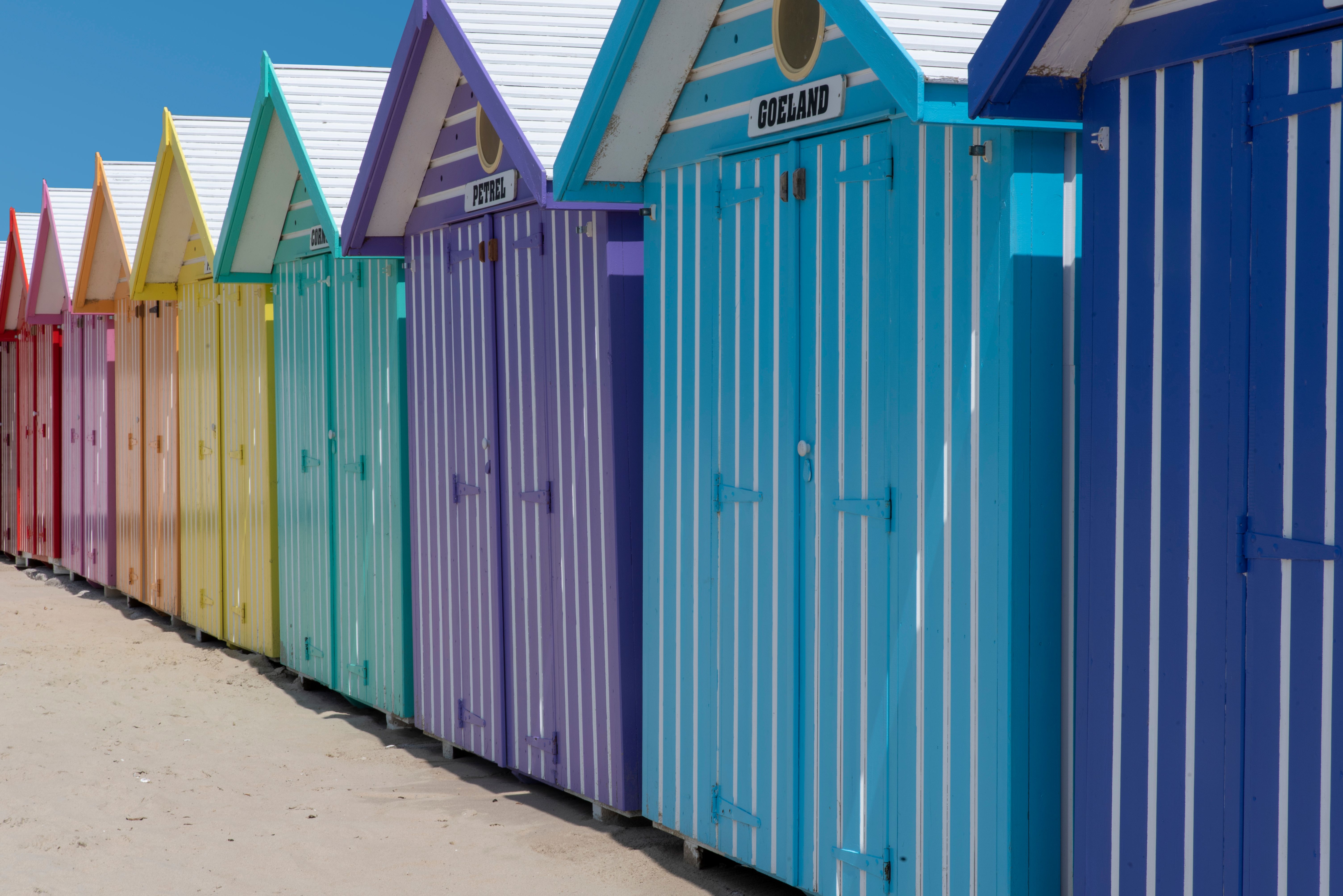 Colorful Beach Huts on Sunny Day · Free Stock Photo