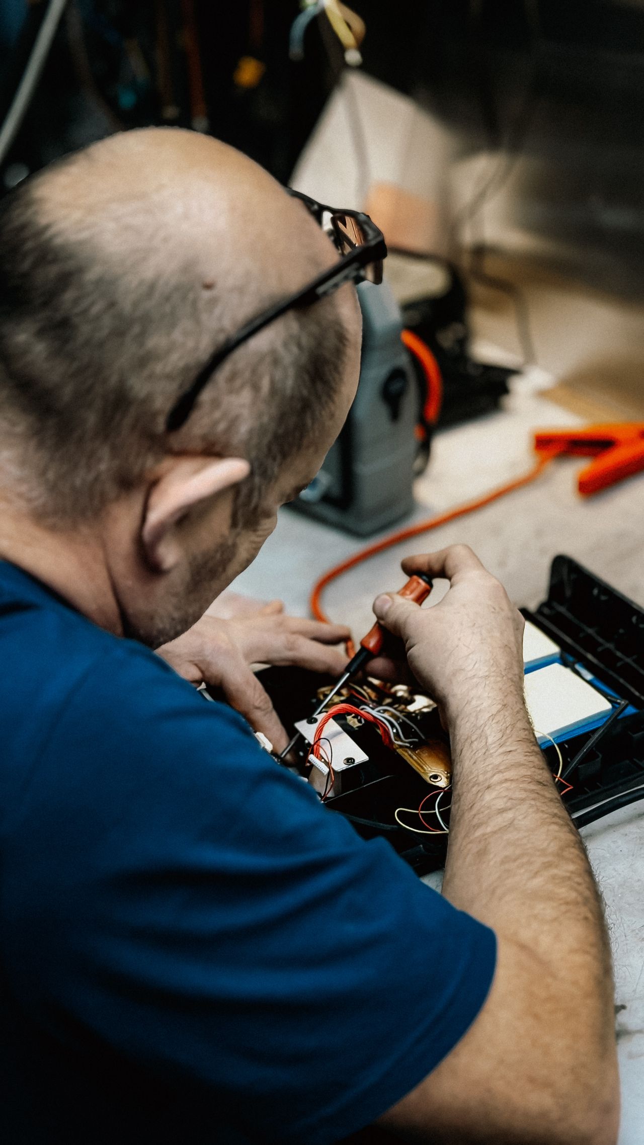 Electrician servicing a residential fuse box