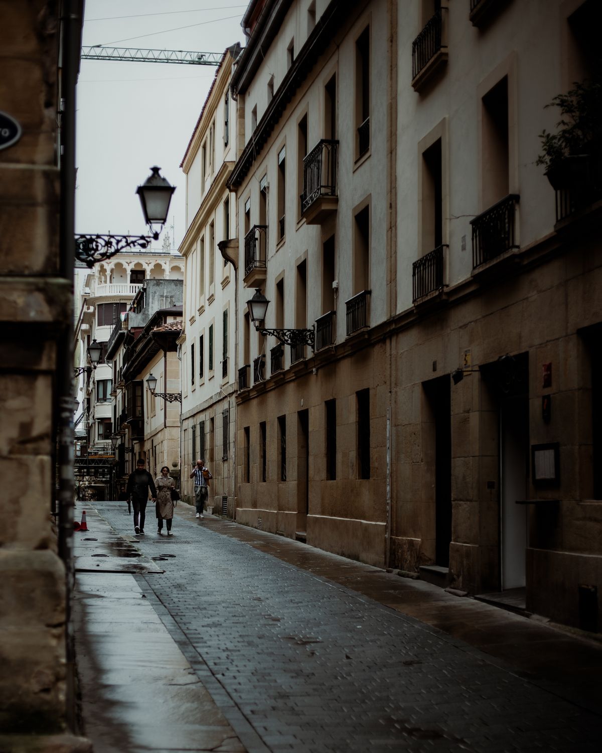 A narrow old European street on an overcast day