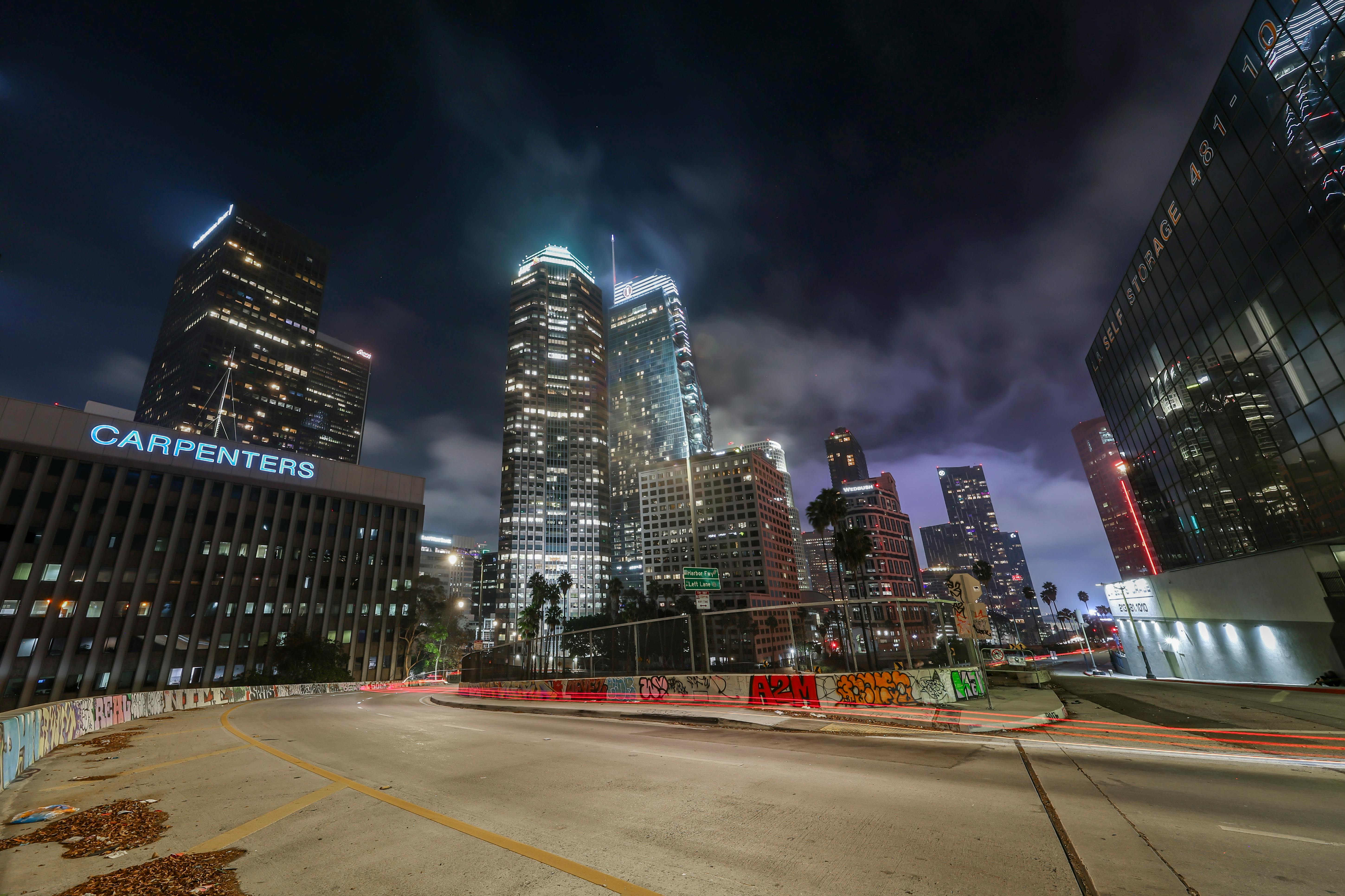 Panoramic Hollywood Hills luxury estate at night overlooking Los Angeles city lights