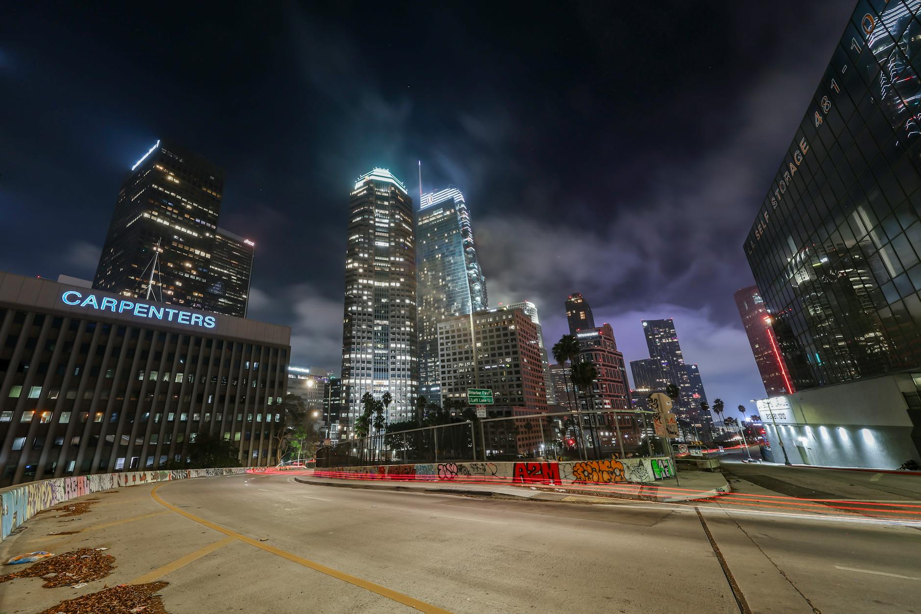 Panoramic Hollywood Hills luxury estate at night overlooking Los Angeles city lights