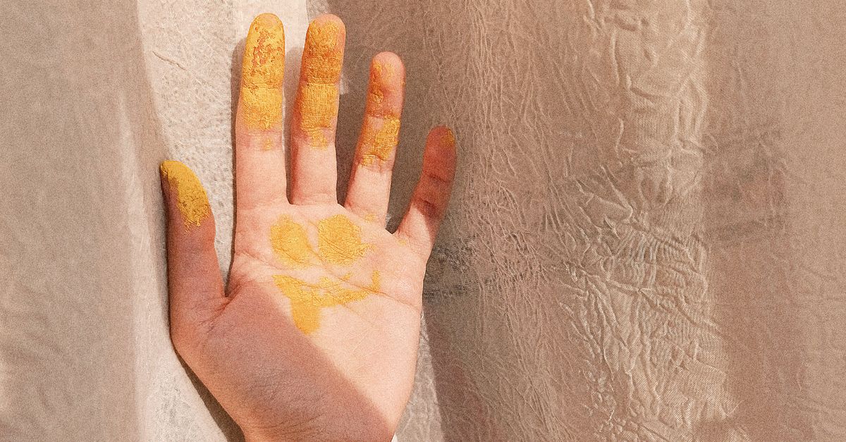 Color Yellow Hand Hand with Yellow Paint on Beige Fabric · Free Stock Photo