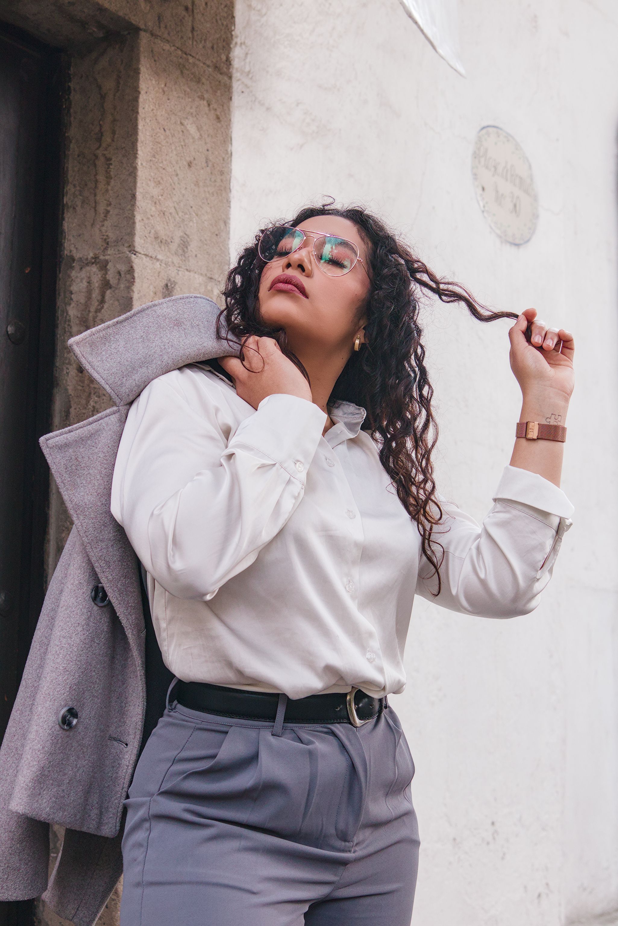 Stylish Woman Posing Outdoors in Business Attire · Free Stock Photo