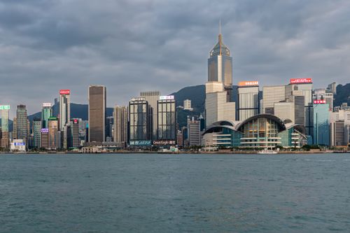 Free A stunning view of Hong Kong's iconic skyline from Victoria Harbour. Stock Photo