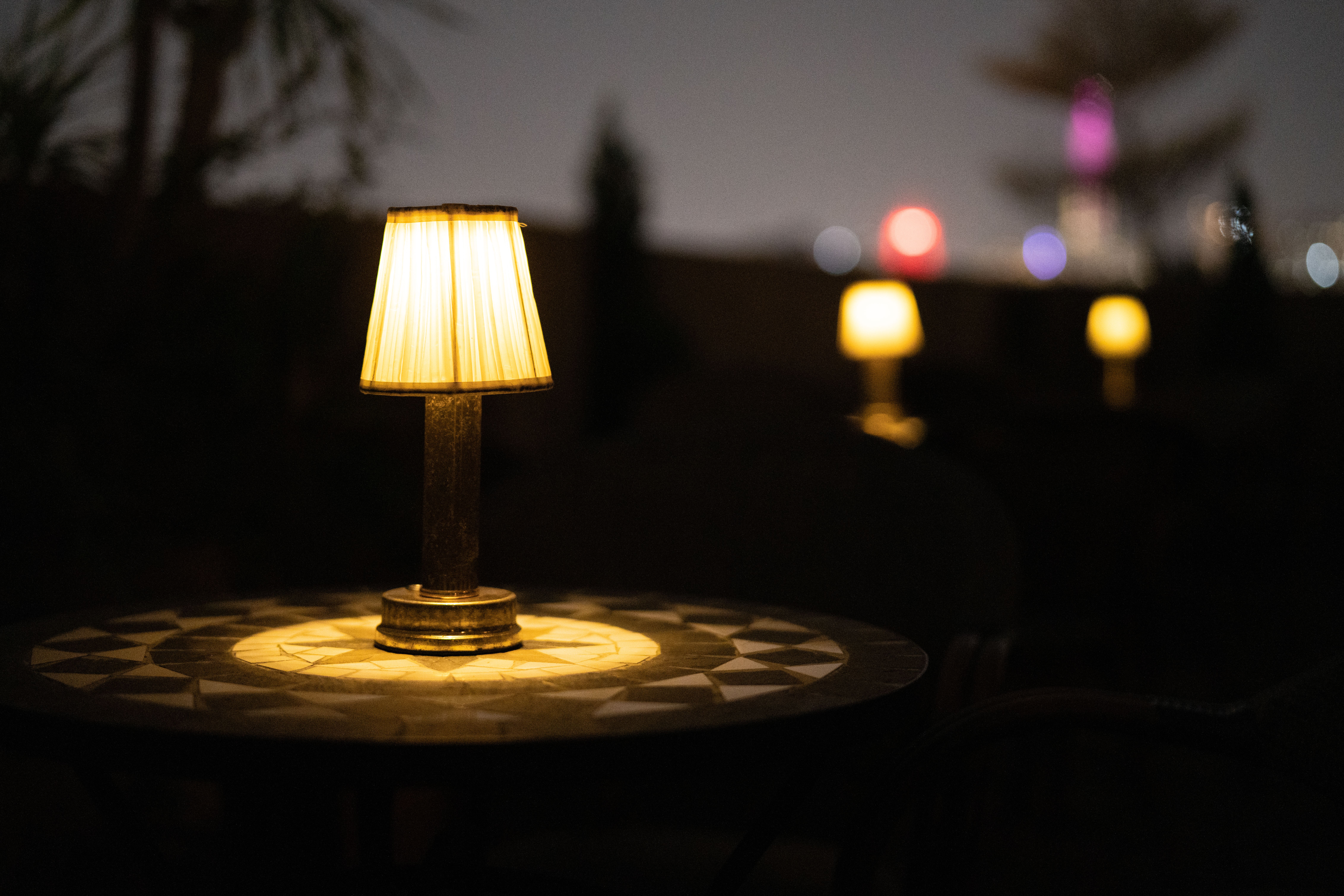 Cozy Outdoor Table with Ambient Lighting at Night · Free Stock Photo