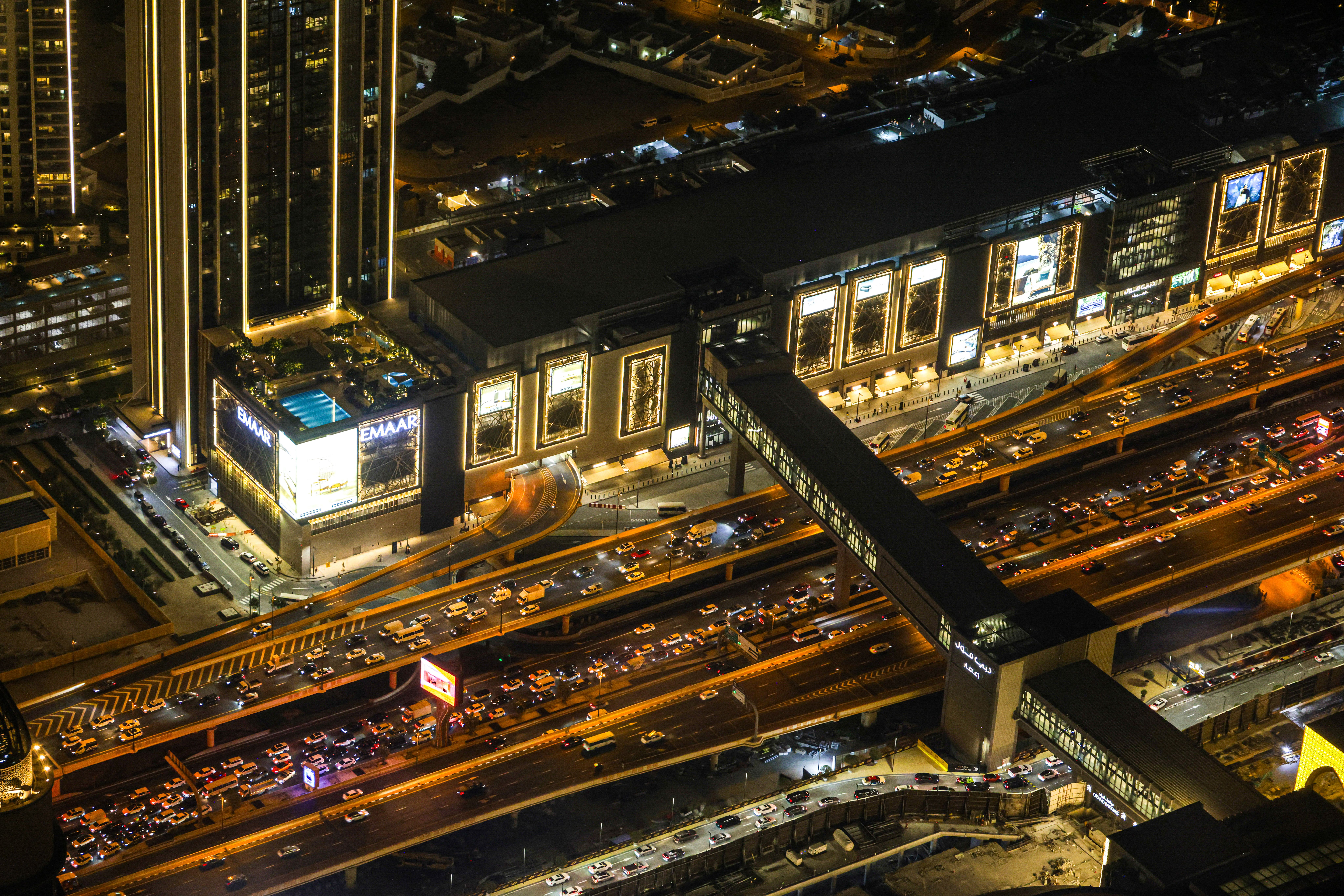 Vibrant Dubai Cityscape at Night with Traffic · Free Stock Photo