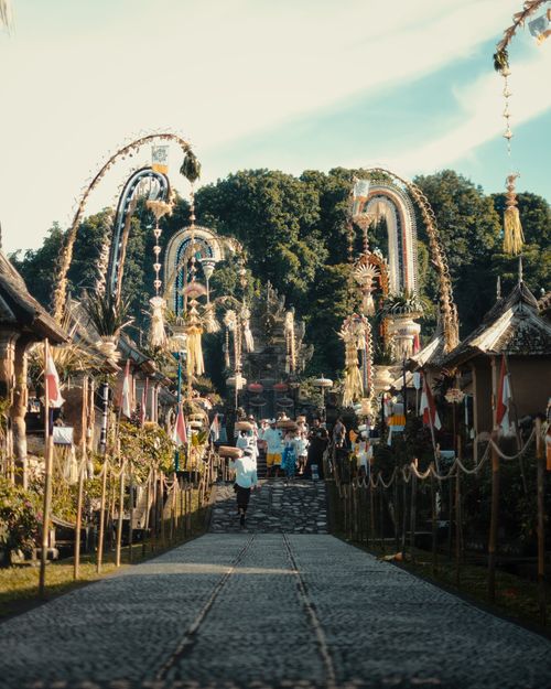 Free A vibrant Balinese celebration showcasing cultural decorations and local architecture. Stock Photo