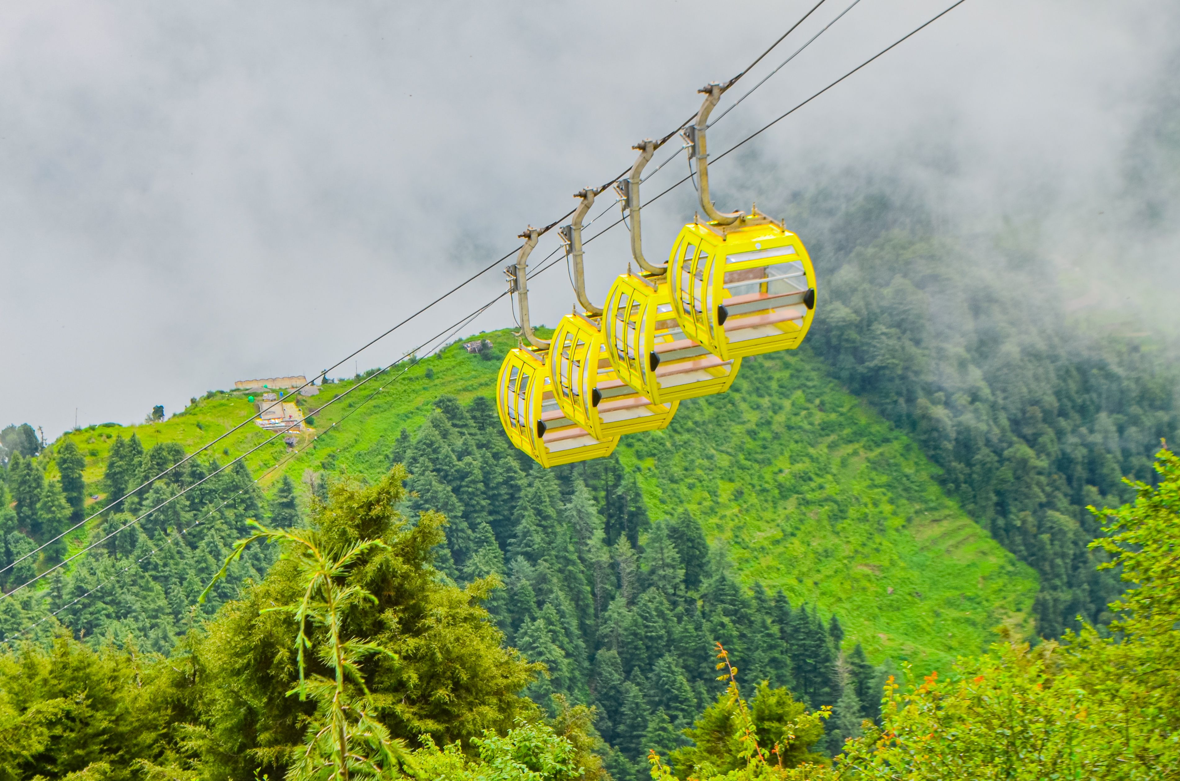Scenic Mountain Ropeway in Misty Green Landscape · Free Stock Photo