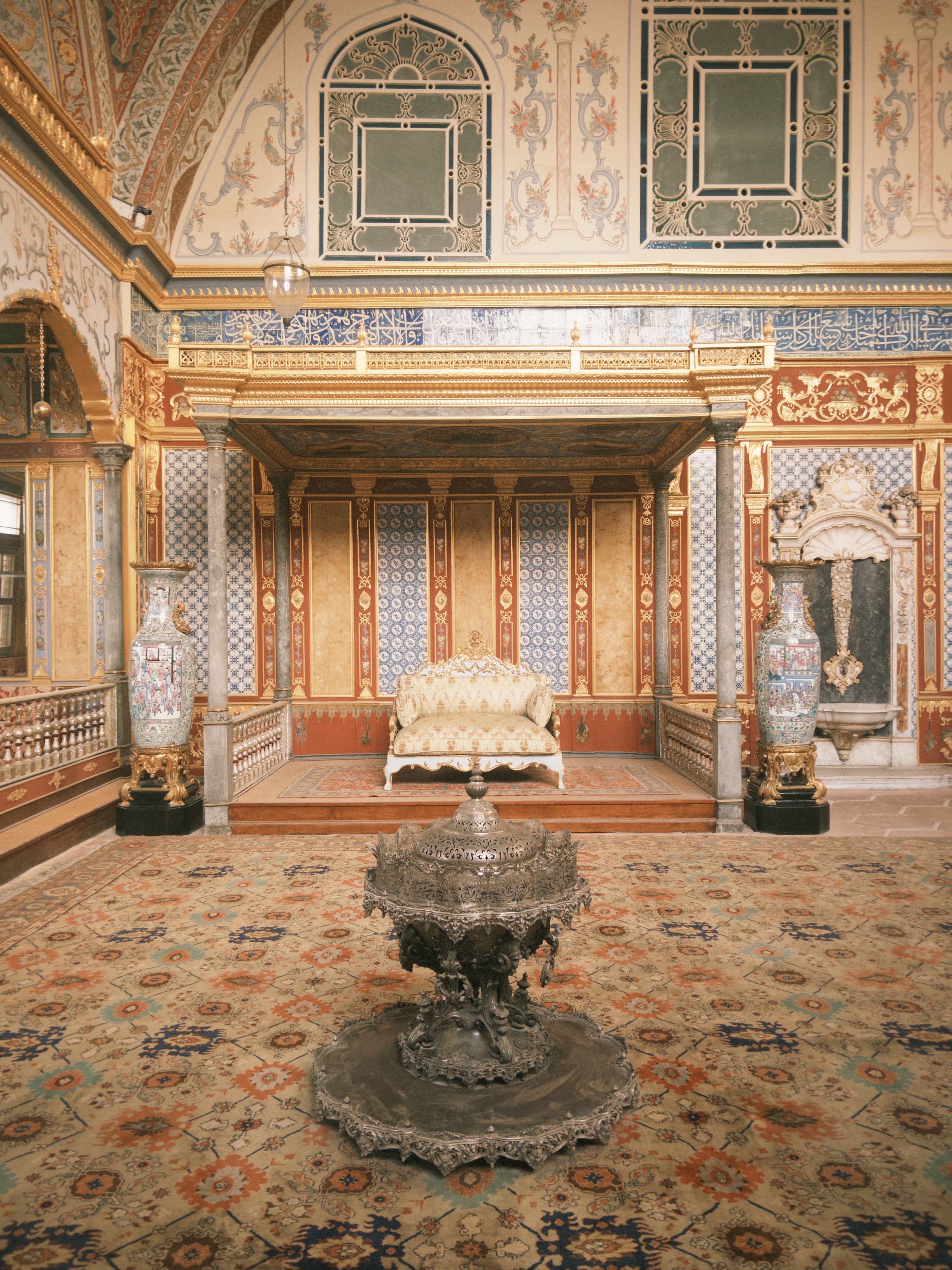 Luxurious Ottoman palace interior featuring ornate decorations and exquisite furnishings.