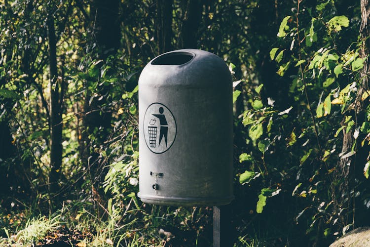 Shallow Focus Photo Of Gray Steel Trash Bin