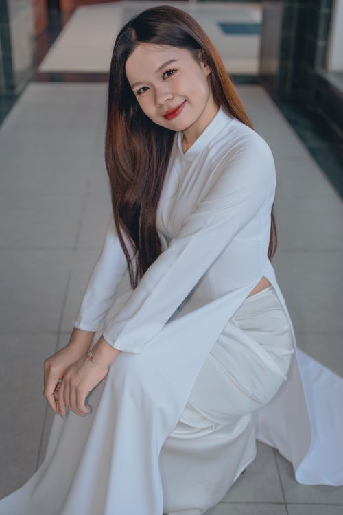 Elegant Woman in Traditional White Dress Indoors · Free Stock Photo
