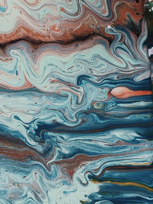 Free Dynamic abstract painting with swirling patterns in blue, brown, and peach, showcasing fluid artistry. Stock Photo