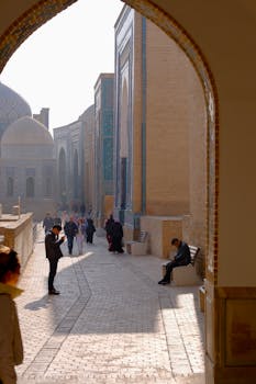 People exploring the historic architecture of Samarkand, Uzbekistan.