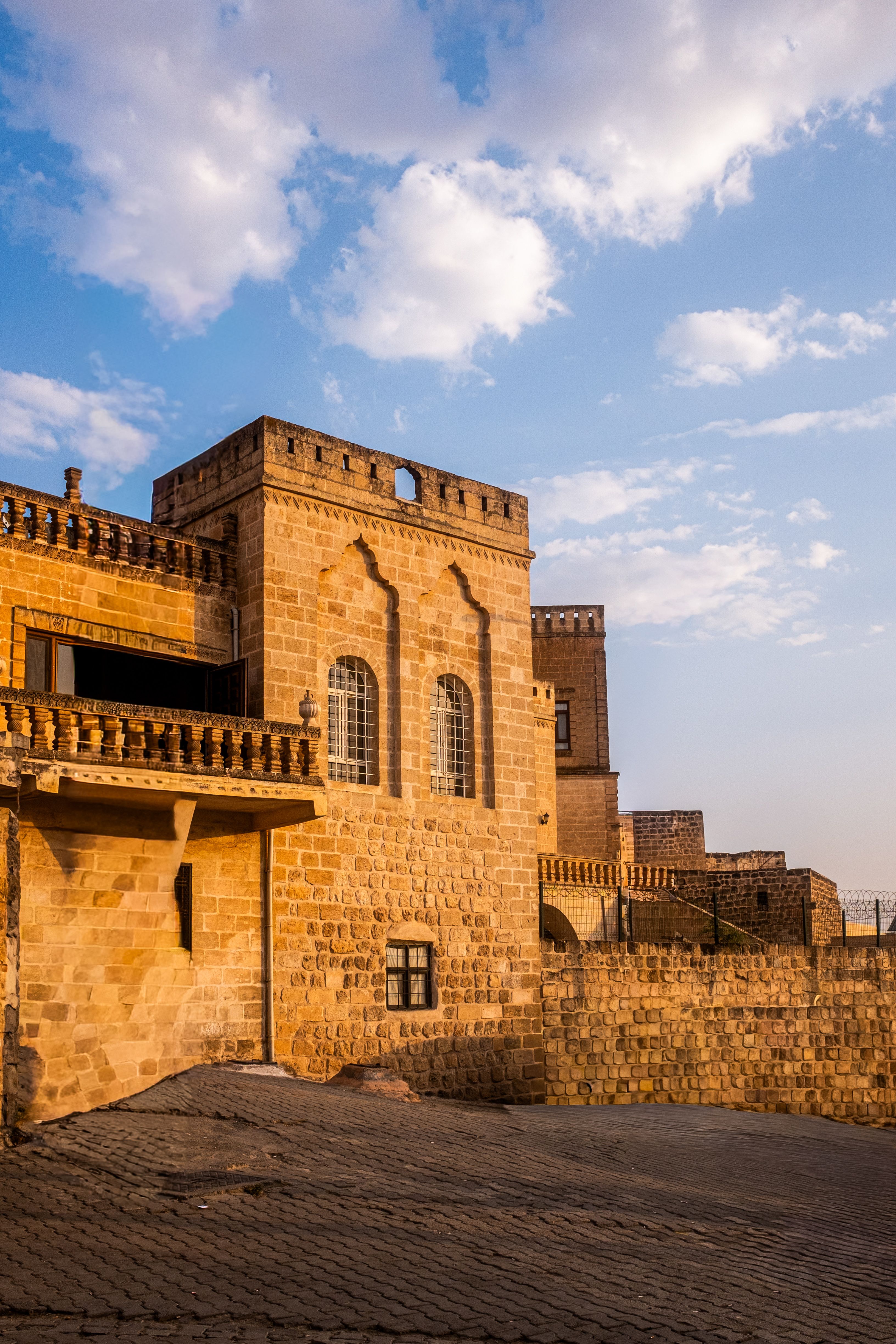 Historic Stone Building Under Blue Sky · Free Stock Photo