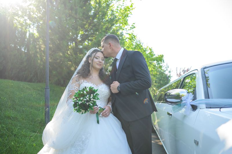 Wedding Limo Bride and groom beside white Toronto wedding limo stretch limousine