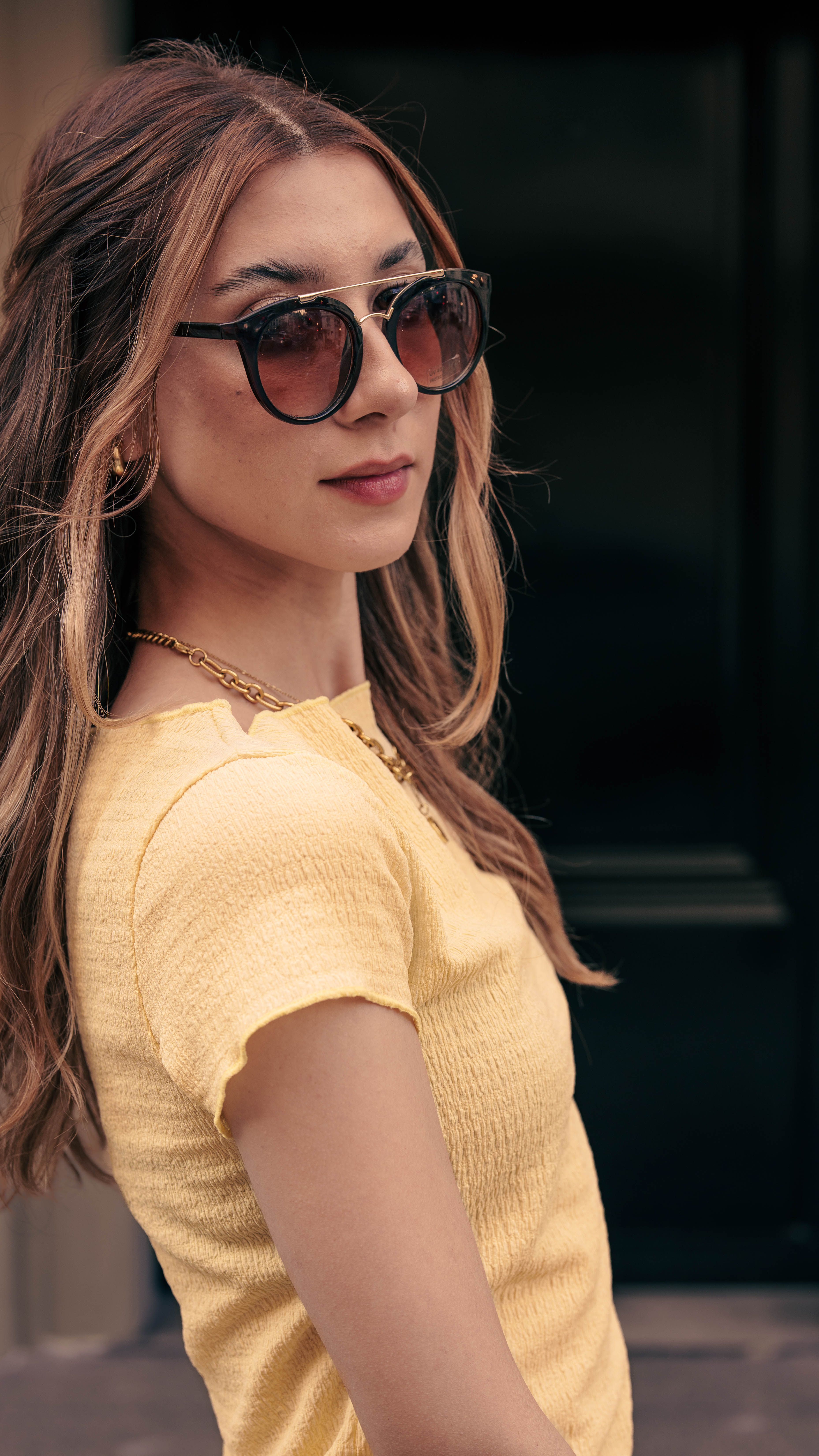 Stylish Woman in Sunglasses on City Street · Free Stock Photo