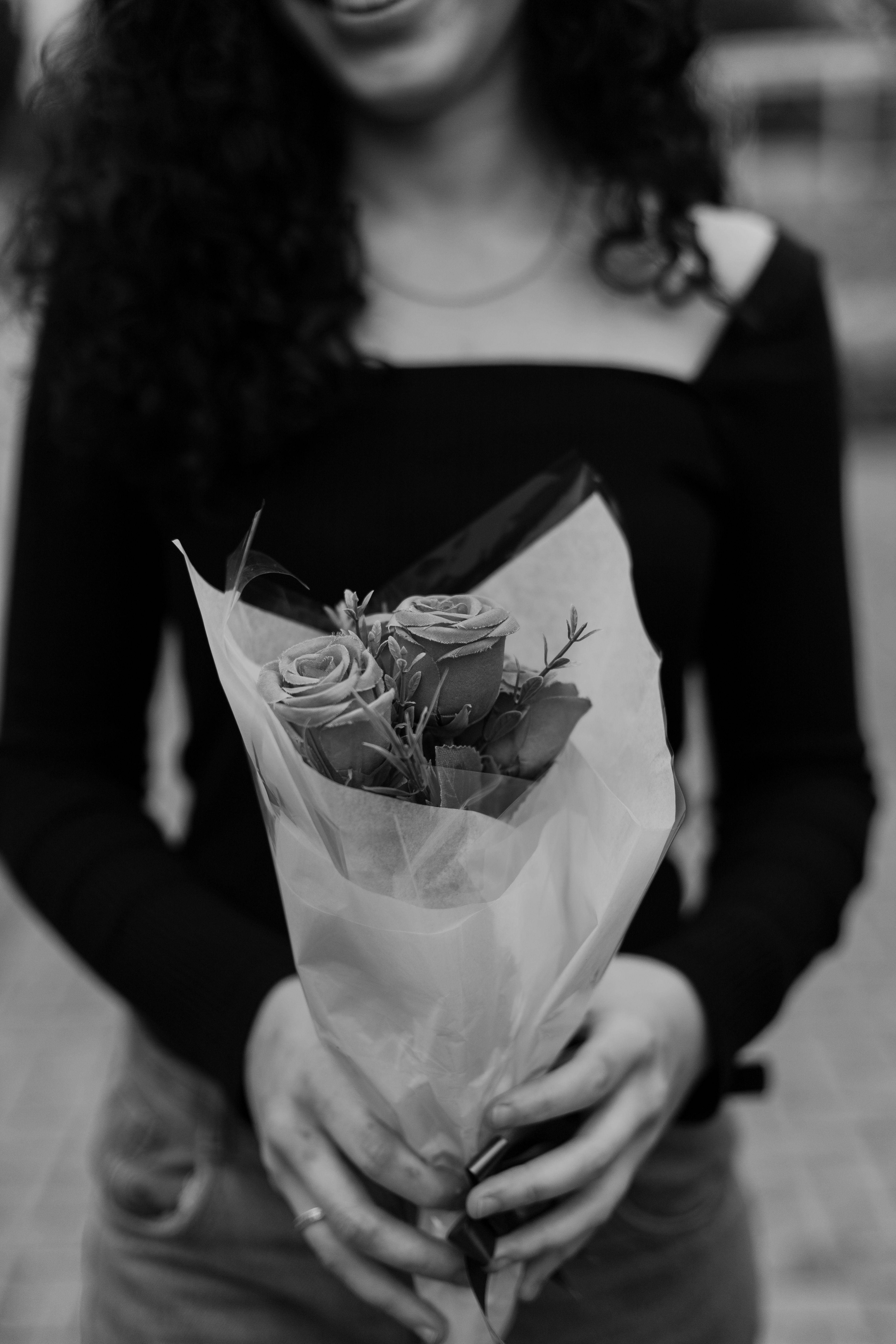 Black and White Portrait of a Woman Holding Roses · Free Stock Photo