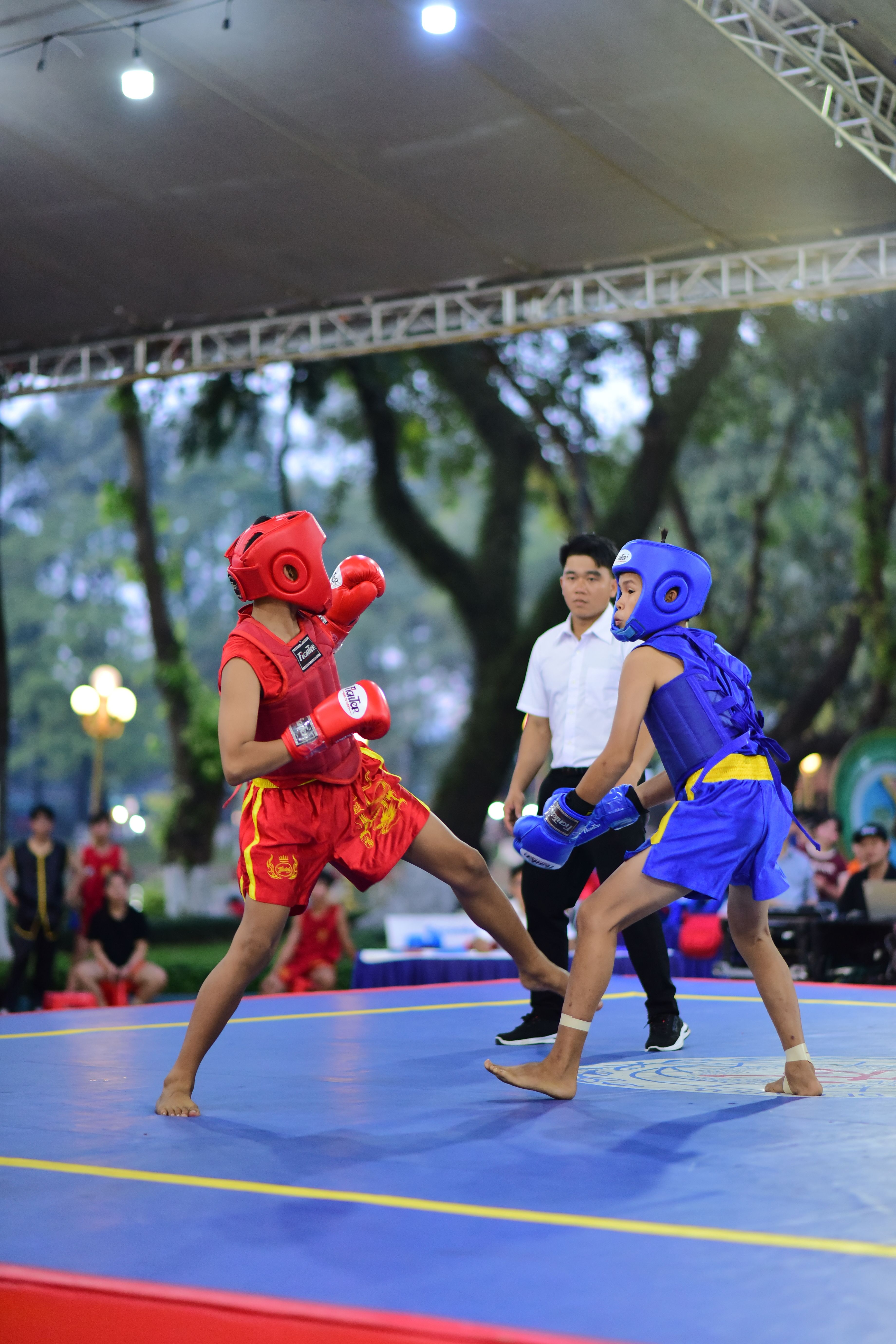 Outdoor Youth Boxing Match with Referee · Free Stock Photo