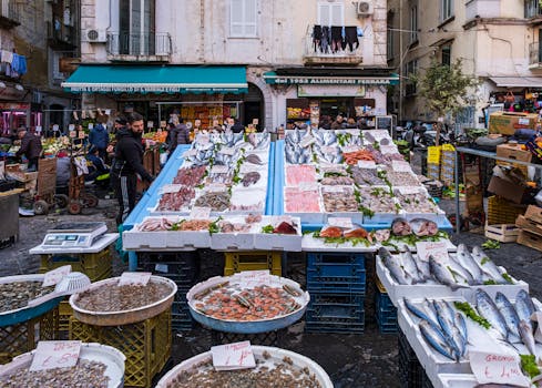 Colorful fish market in Campania, Italy, showcasing fresh seafood variety on display.