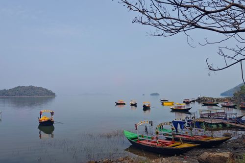 Free Serene view of colorful boats on Maithon Lake in Jharkhand, India, offering a peaceful and picturesque travel scene. Stock Photo