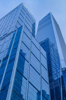 Modern skyscrapers rising against the blue sky in Midtown Manhattan, New York City.