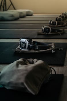 Yoga mats with headphones set up for a silent yoga class indoors in Jakarta, Indonesia.