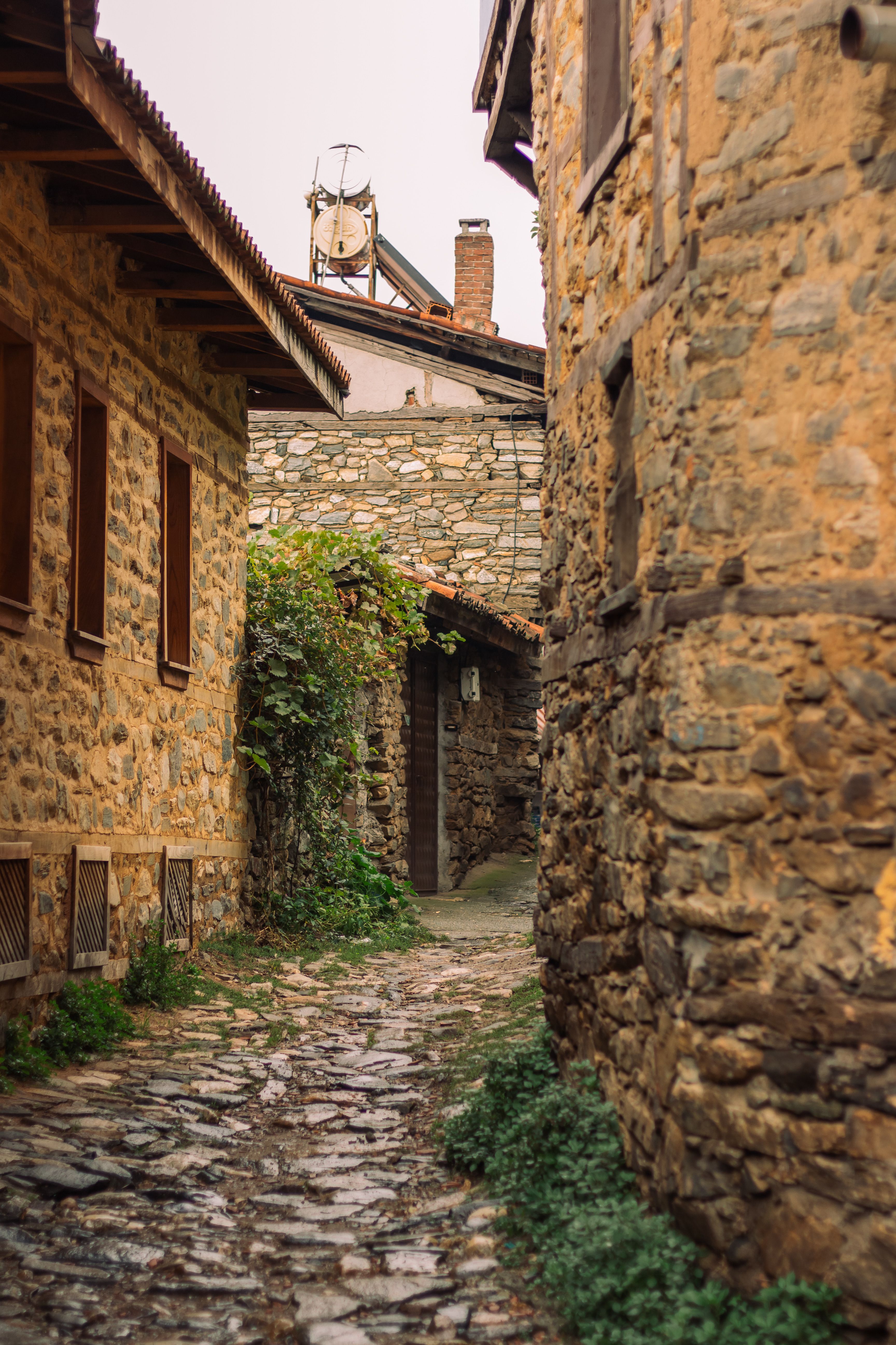 Charming Narrow Stone Alleyway in Rustic Village · Free Stock Photo