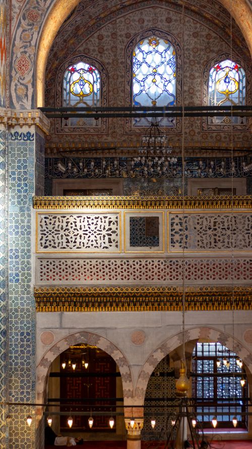 Free Interior view of a historic mosque showcasing intricate tilework and stained glass windows. Stock Photo