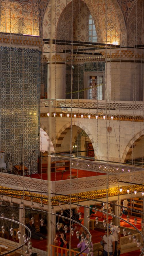 Free Beautiful interior view of a historic mosque with arches and ornate tile work, showcasing architectural elegance. Stock Photo