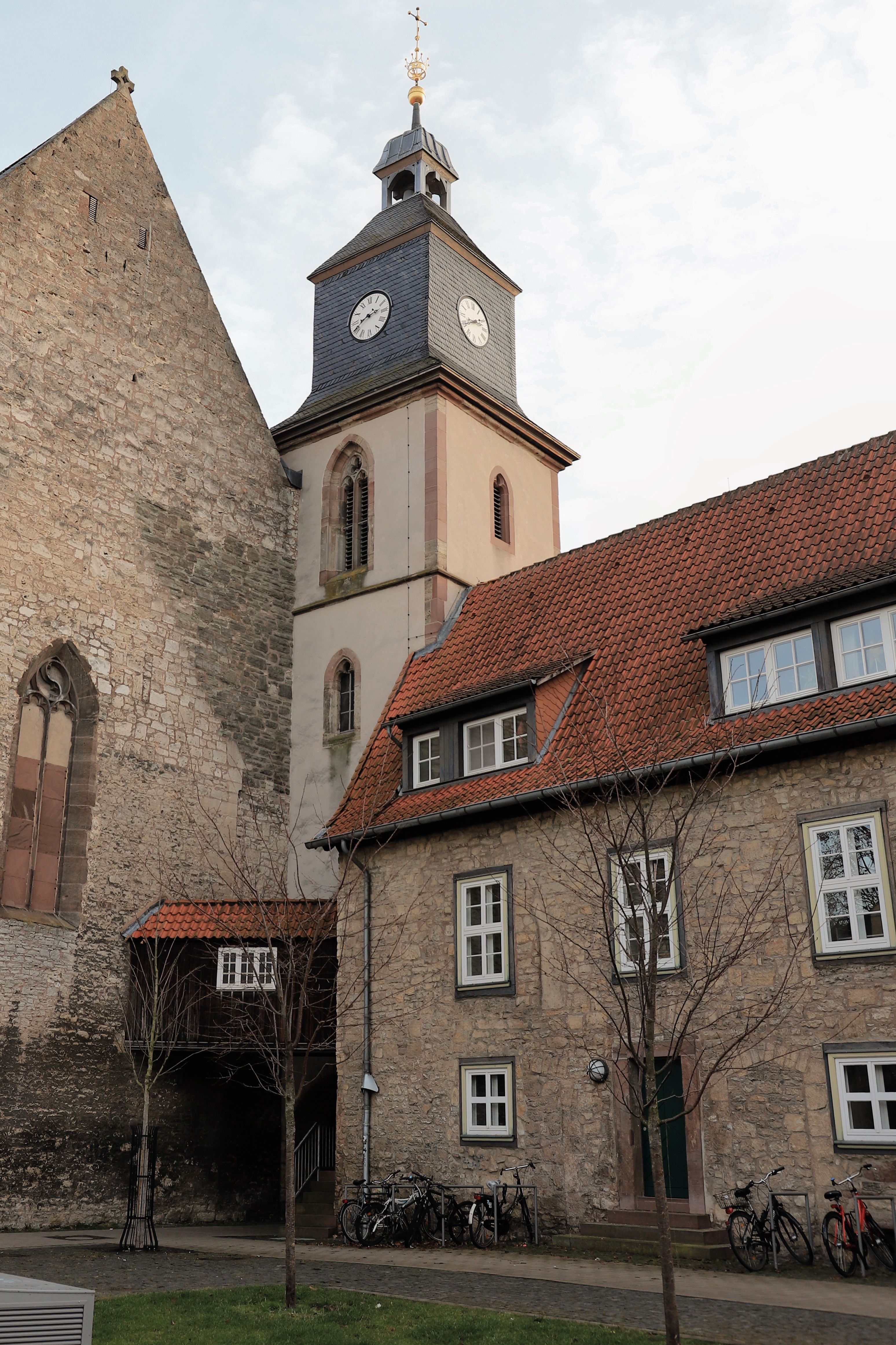 Scenic view of historical church tower and buildings in Göttingen, Germany.