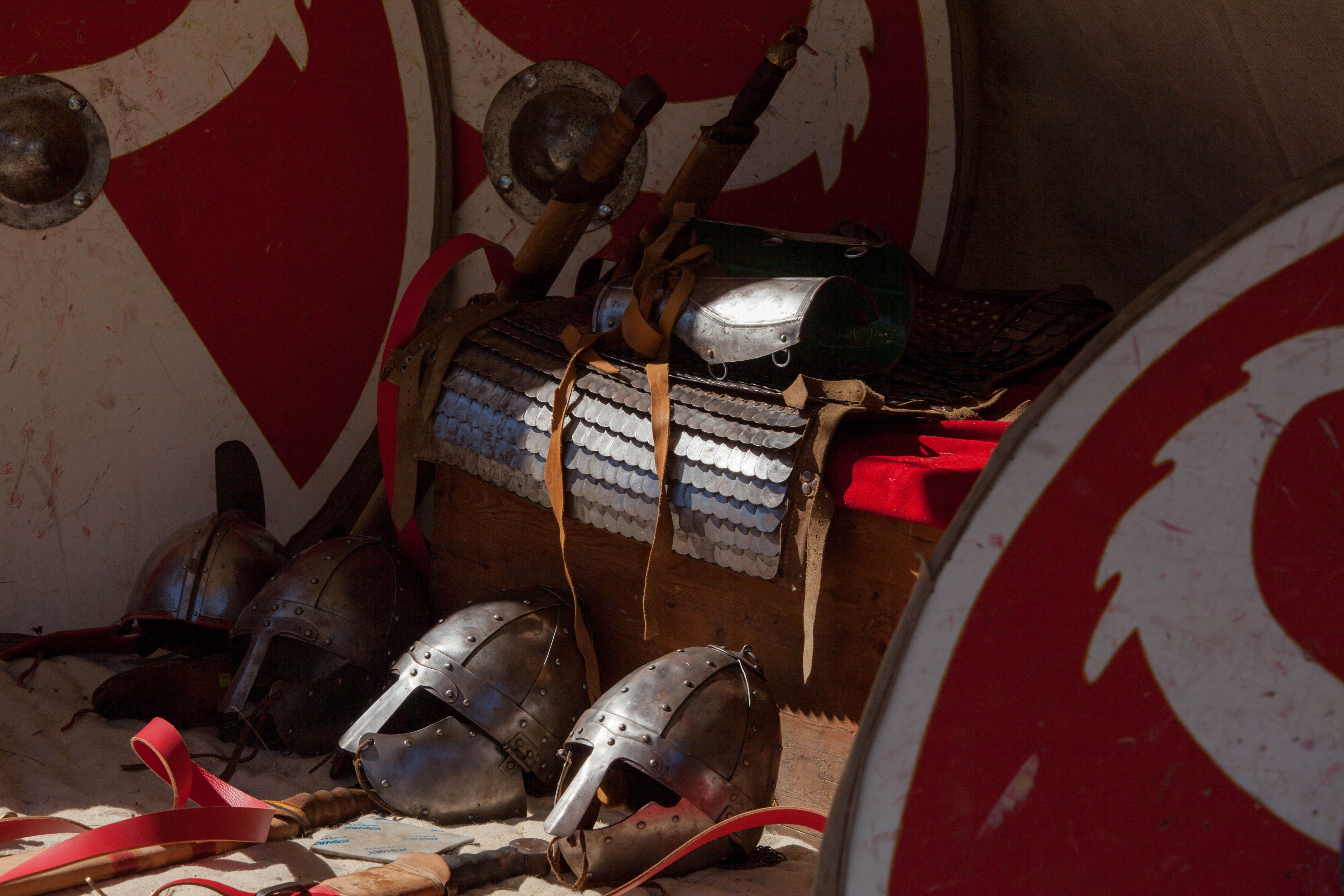 Detailed display of ancient Roman armor and weapons, showcasing historical artifacts.