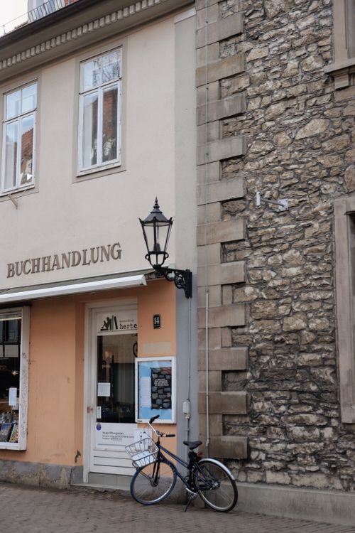Free Cozy bookstore with a bicycle parked outside in historic Göttingen, Germany. Stock Photo