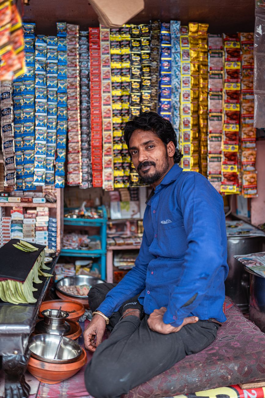 Small business owner in India running their shop