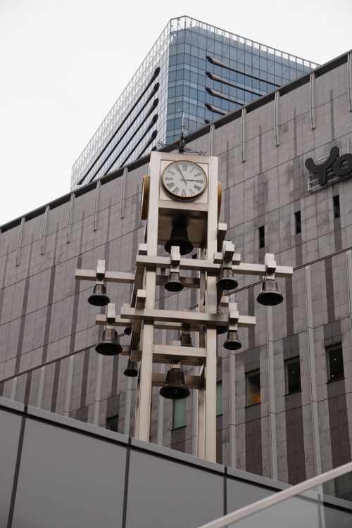Free Iconic clock tower with bells at Osaka Station, showcasing modern architecture in Japan. Stock Photo